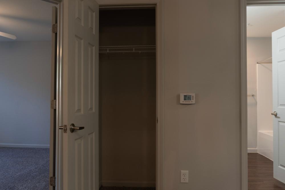 Closet space and bathroom view in bedroom at Redland Creek in Lawrenceville, Georgia