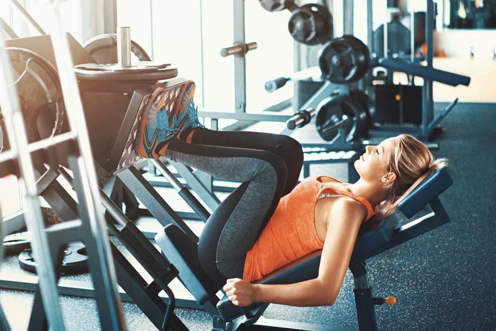 Resident working out in the fitness center at Sunrise Fountains in Anaheim,California