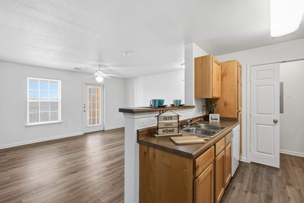 Bright, open living space with modern kitchen and natural light at Riverside Park in Early, Texas