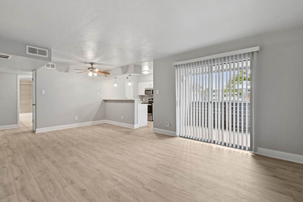 Unfurnished living room with access to patio at Avondale Parc at Bellmar in Dallas, Texas