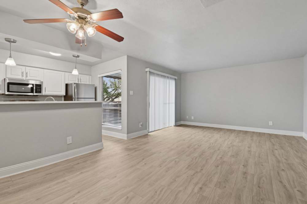 Unfurnished living room with ceiling fan at Avondale Parc at Bellmar in Dallas, Texas