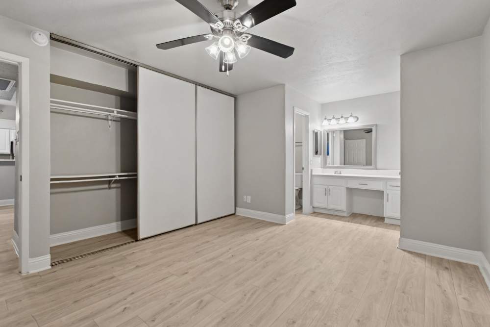 Large bedroom with attached bathroom and closet at Avondale Parc at Bellmar in Dallas, Texas