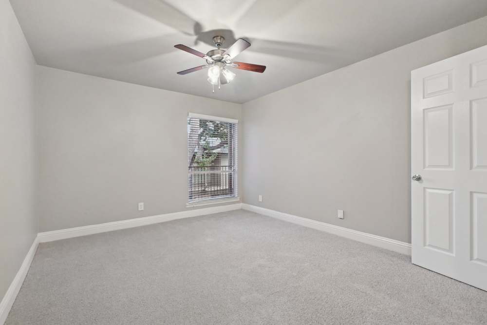 Unfurnished bedroom with carpeted flooring at Avondale Parc at Bellmar in Dallas, Texas