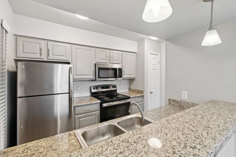 Kitchen with spacious countertop at Avondale Parc at Bellmar in Dallas, Texas