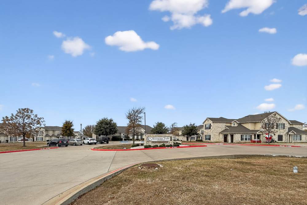 Community signage board with building  at Riverstone Trails in Sunnyvale, Texas