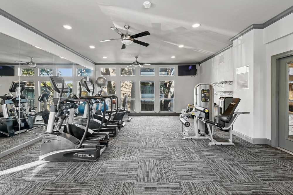 Well-equipped fitness center with cardio equipment at Aberdeen at Bellmar in Dallas, Texas