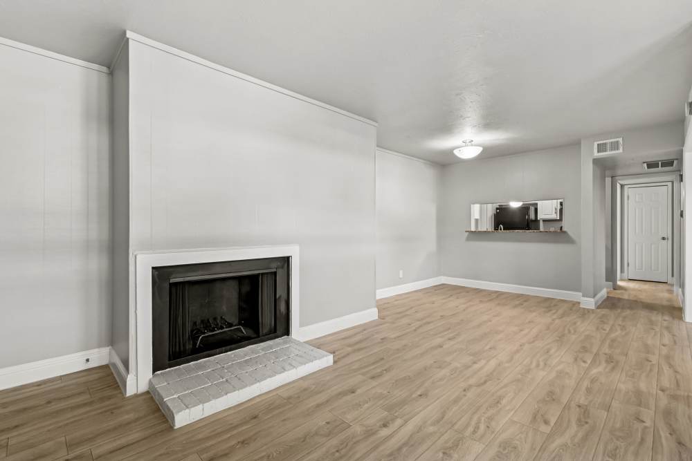 Unfurnished living room with firepit at Aberdeen at Bellmar in Dallas, Texas
