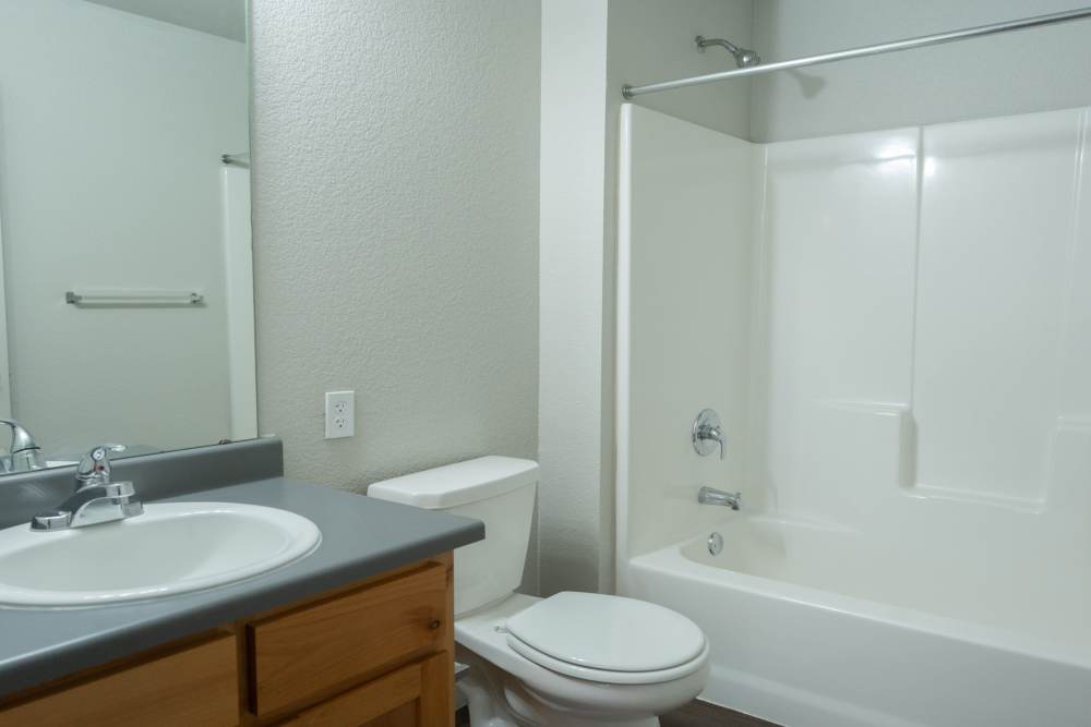 Bright bathroom with modern fixtures and clean design at Savannah Terrace in Mustang, Oklahoma
