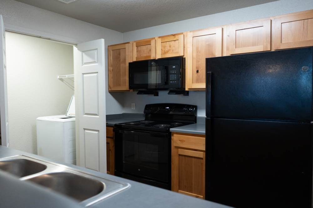 Upgraded kitchen with modern appliances and ample storage space at Savannah Terrace in Mustang, Oklahoma