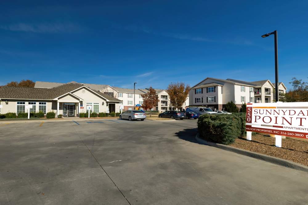 Property signage board with exterior shot at Sunnydale Pointe in Wichita, Kansas