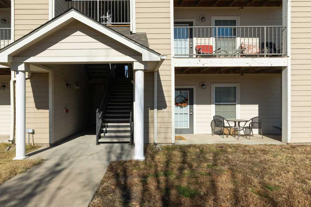 Community front view with apartment patio and balcony at Sunnydale Pointe in Wichita, Kansas