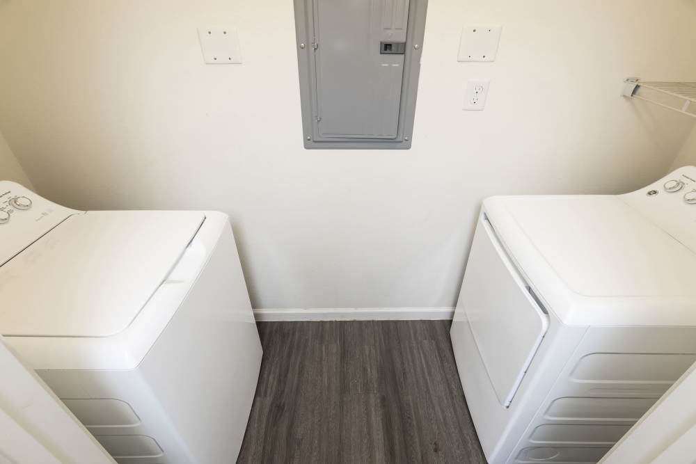 Laundry area with washer and dryer at Sunnydale Pointe in Wichita, Kansas