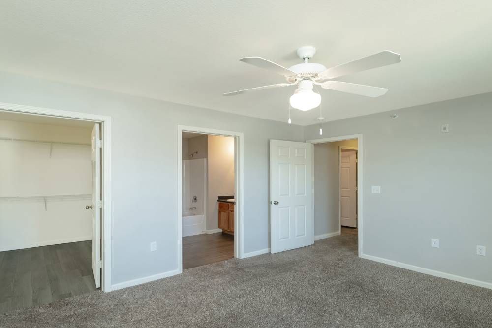Bedroom with walk-in closets at Sunnydale Pointe in Wichita, Kansas