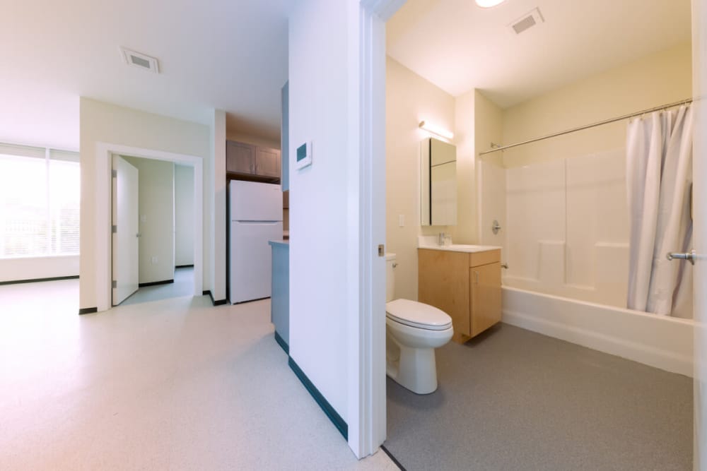 Bathroom with hard flooring, waterfall faucet sink, and storage space at  Island Parkside in Lawrence, Massachusetts