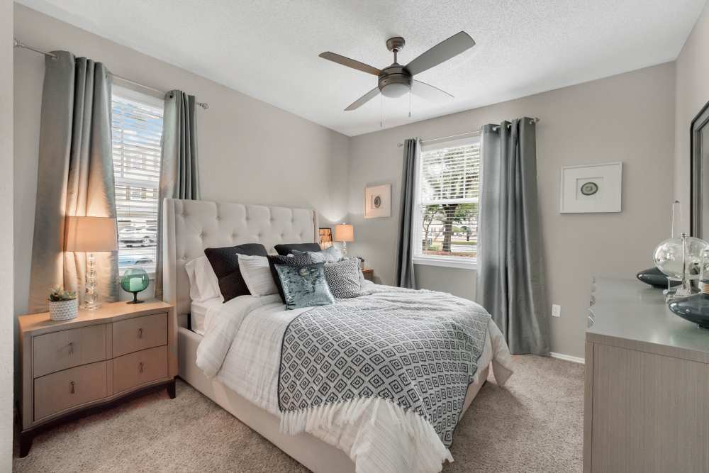 Bedroom with ceiling fan and sophisticated designs at Dawson in Orlando, Florida