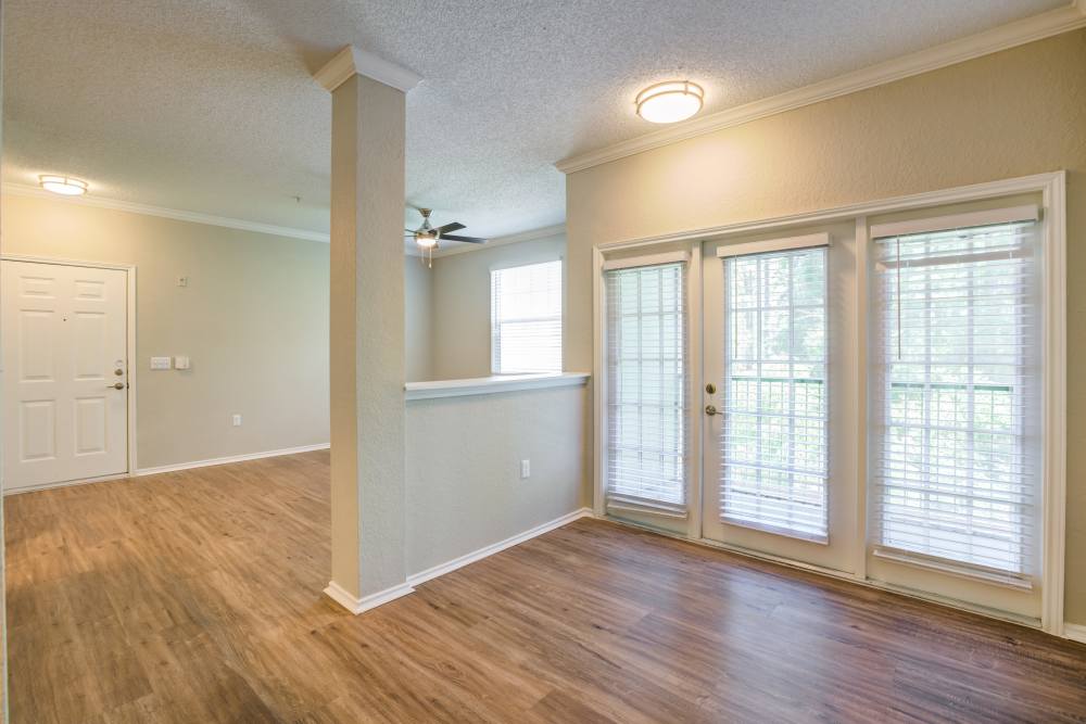 Unfurnished living room with large windows at Dawson in Orlando, Florida