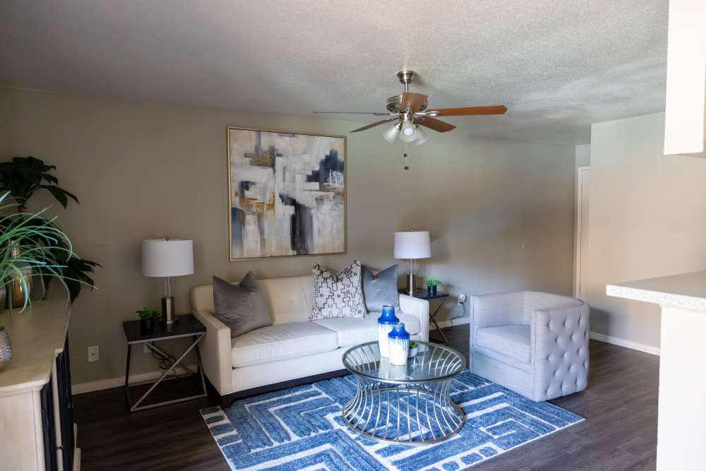 Living room with wooden flooring at Rivercrest in Waco, Texas 