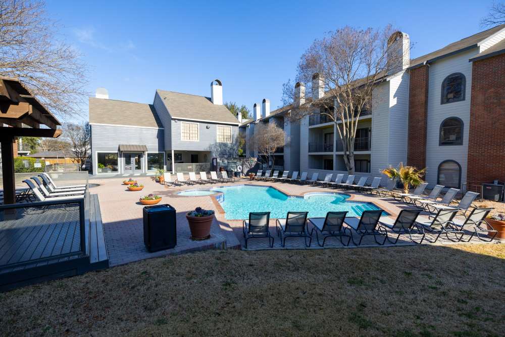 Swimming pool with lots of lounge chairs at Rivercrest in Waco, Texas 