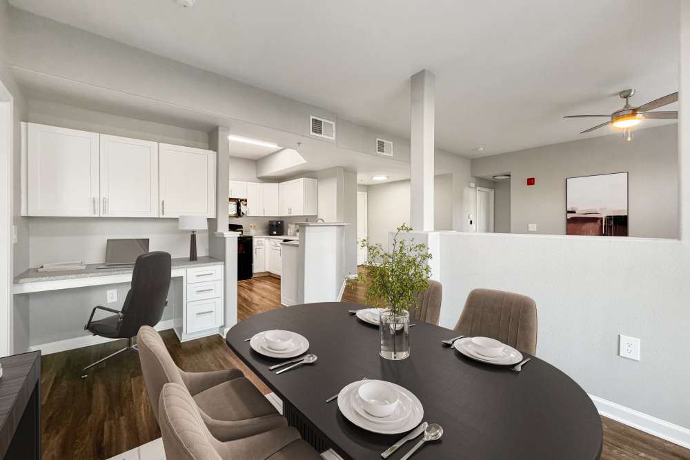 A living room area connected to the kitchen in an apartment at The Lofts in Sacramento, California