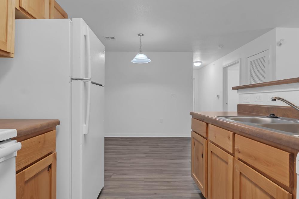 Upgraded kitchen with modern appliances and spacious layout at Wickham Gardens in Sapulpa, Oklahoma