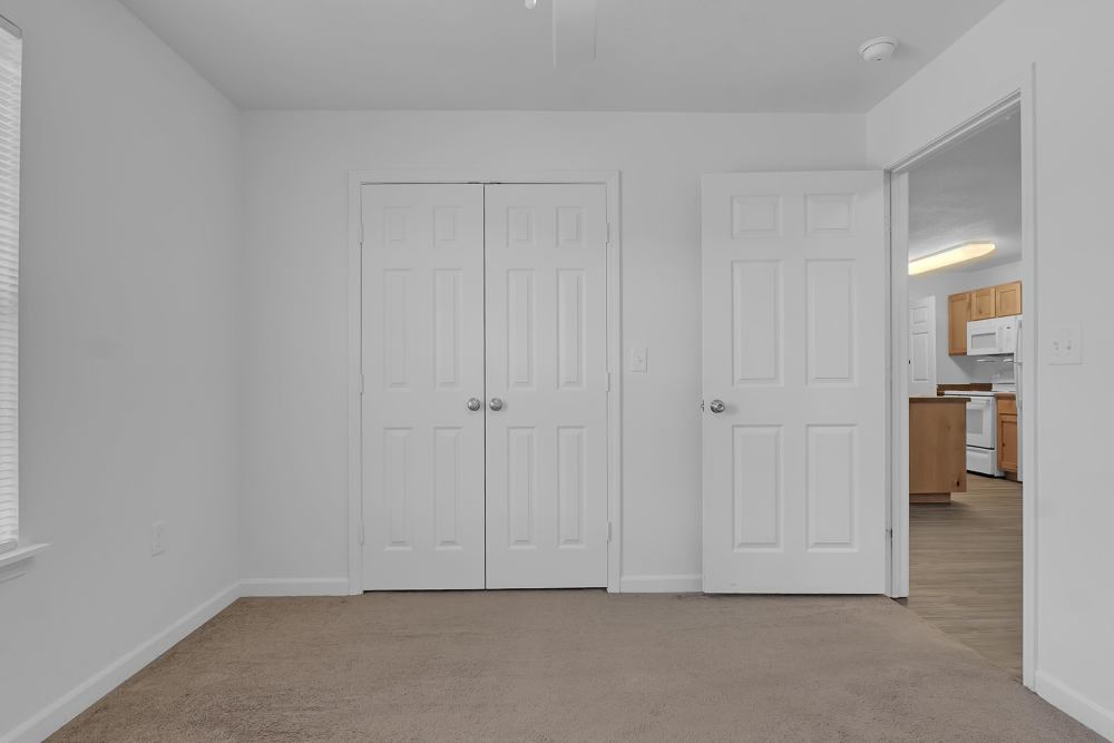 Cozy room with double closets and adjacent kitchen entrance at Wickham Gardens in Sapulpa, Oklahoma