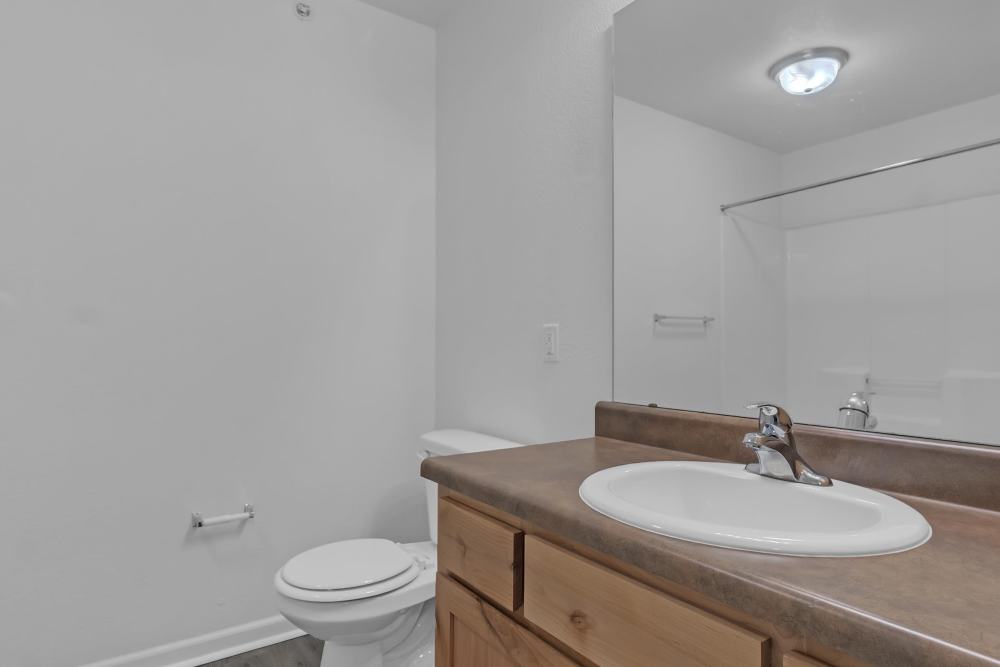 Bright bathroom with modern fixtures and neutral tones at Wickham Gardens in Sapulpa, Oklahoma