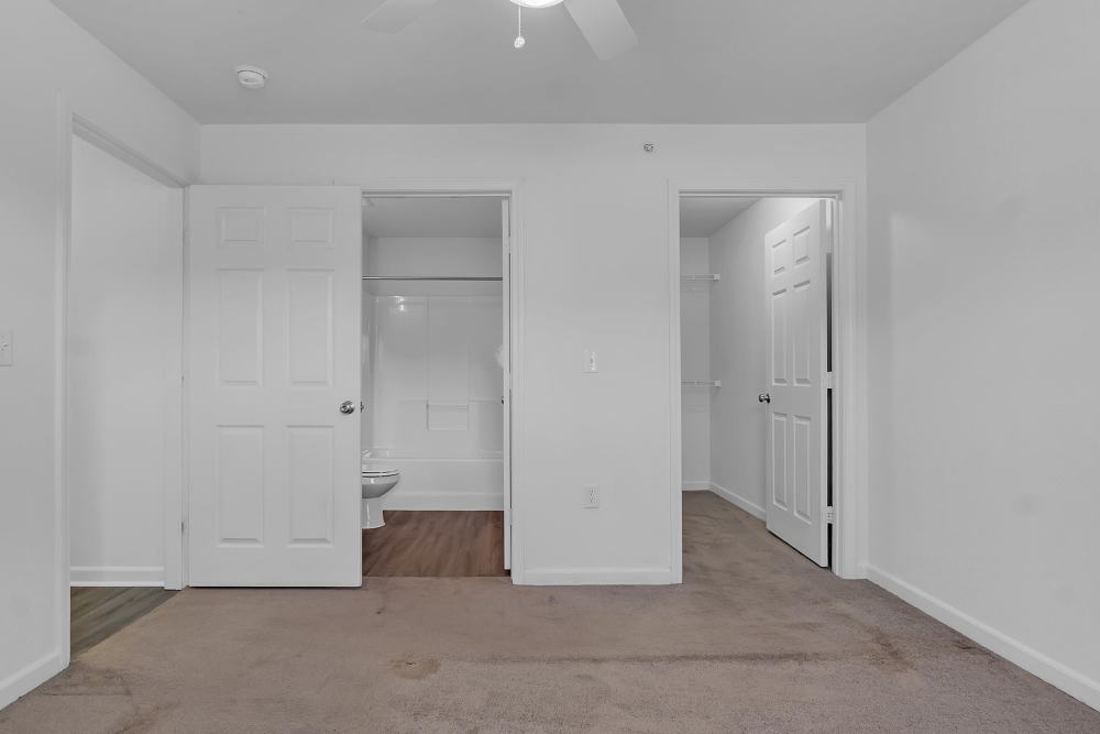 Spacious bedroom with adjoining bathroom and closet space at Wickham Gardens in Sapulpa, Oklahoma