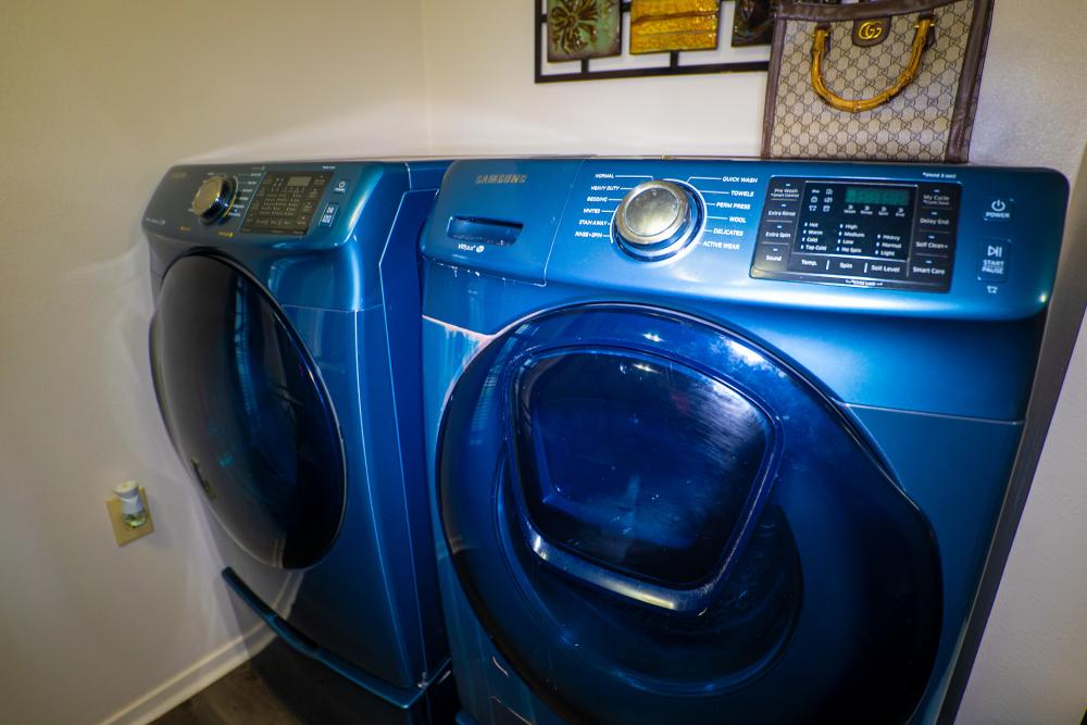 Laundry area with machines at Willowbrook II in Lafayette, Louisiana