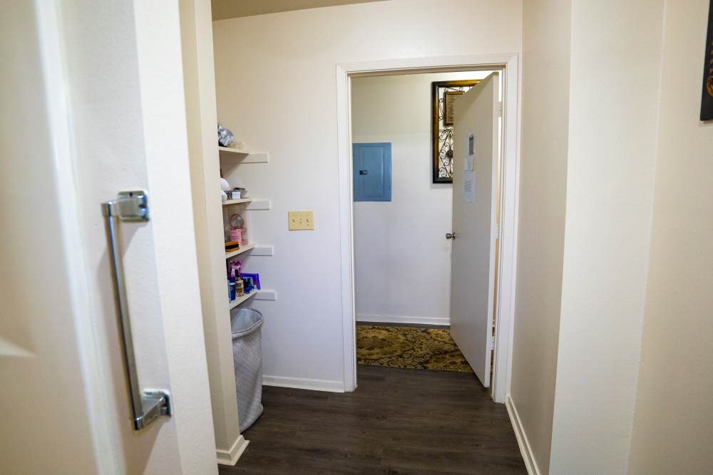 Apartment bathroom with built‑in side shelves at Willowbrook II in Lafayette, Louisiana