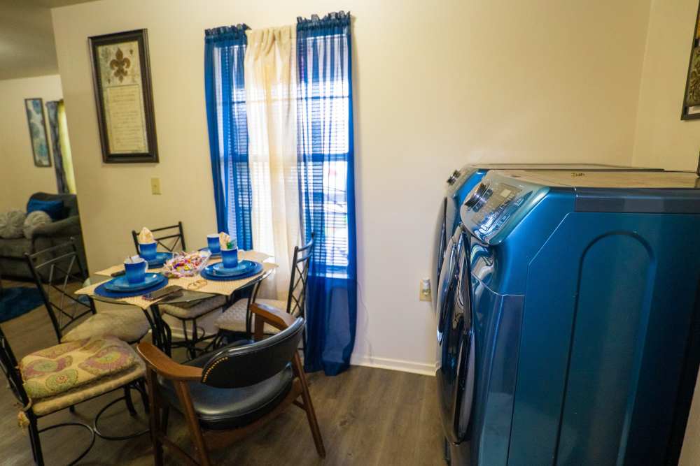 Cozy dining spot and the laundry area beside it at Willowbrook II in Lafayette, Louisiana