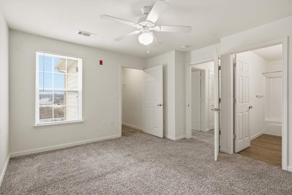 Spacious bedroom with soft carpet and bright natural light at Wood Falls in Lebanon, Tennessee