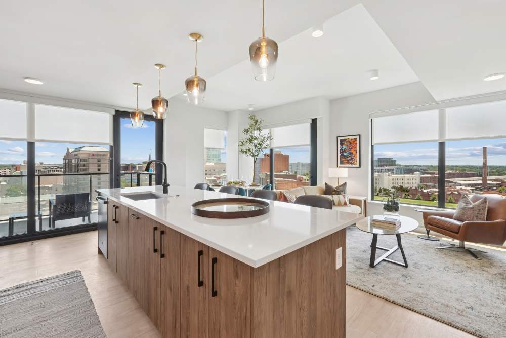 Spacious kitchen island in a home with an open floor plan at The Novus Apartments in Durham, North Carolina