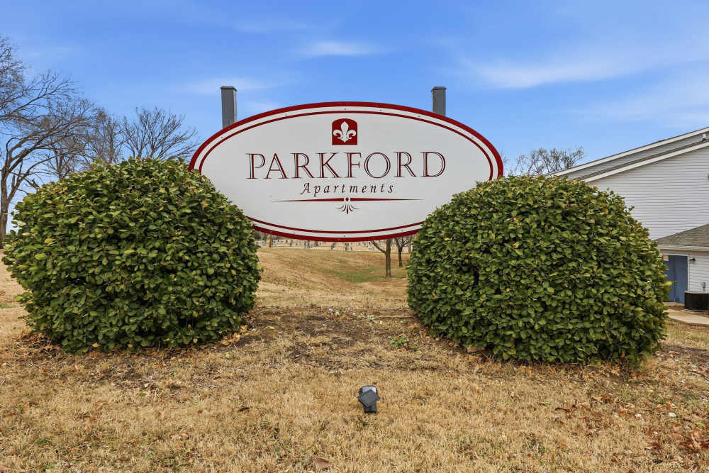 A monument sign of the apartment homes at Parkford Apartments in Iola, Kansas