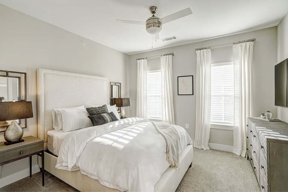Bedroom with ceiling fan at City Limits Apartments in Columbia, Tennessee