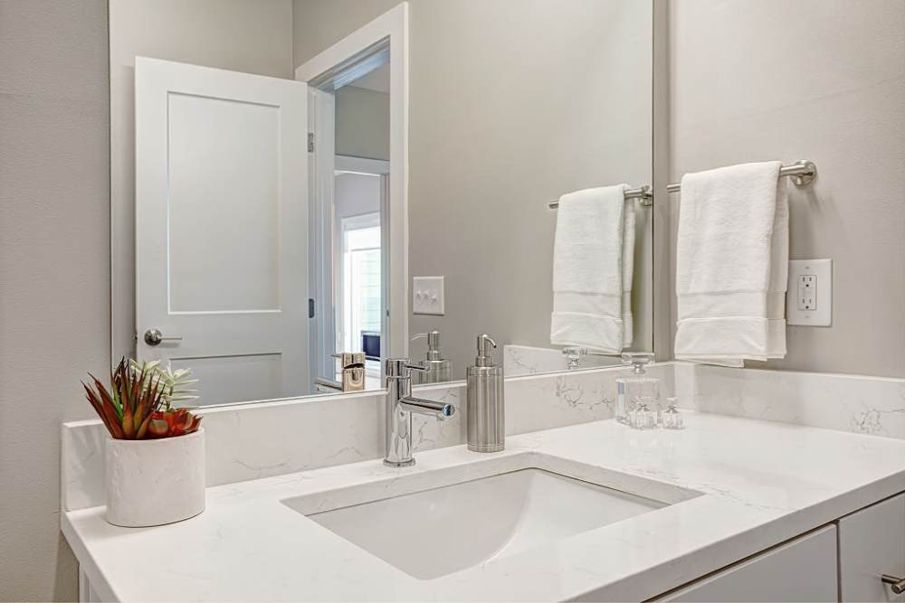 Bathroom with solid counter at City Limits Apartments in Columbia, Tennessee