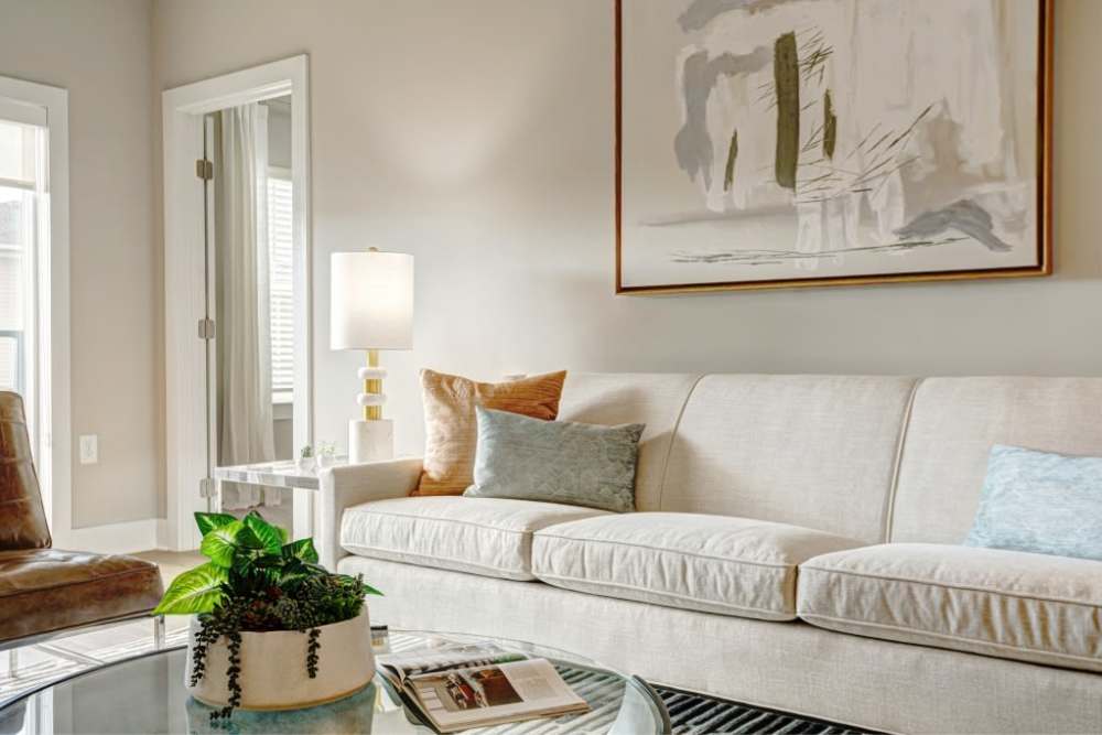 Light-colored sofa in living room at City Limits Apartments in Columbia, Tennessee
