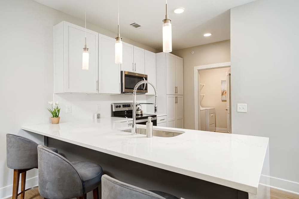 Modern kitchen with spacious breakfast bar at City Limits Apartments in Columbia, Tennessee