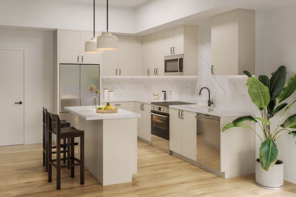 A stylish kitchen with a sleek white countertop and rich wooden flooring, enhancing the space's warmth and elegance  at Haven + Arrow in Rancho Cucamonga, California