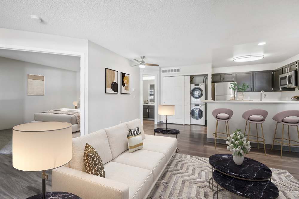Living room with view of kithen and bedroom at Bluesky Landing Apartments in Lakewood, Colorado