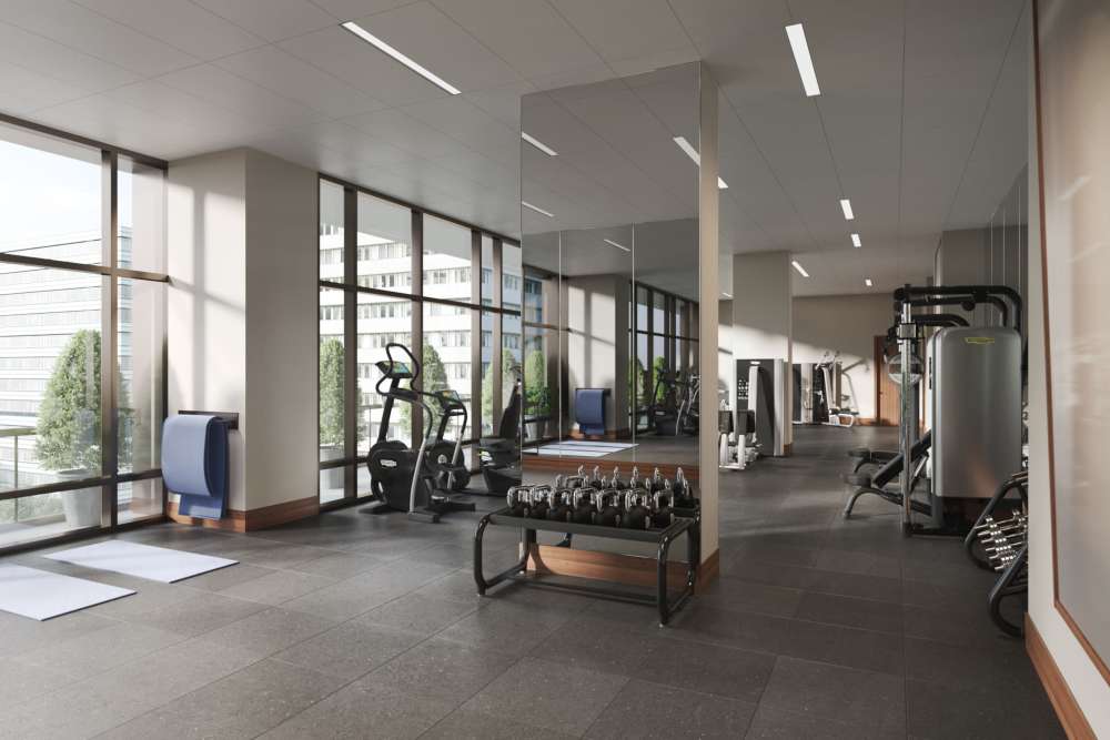 Fully-equipped gym with treadmills, weight machines at Ardan in Dallas, Texas 