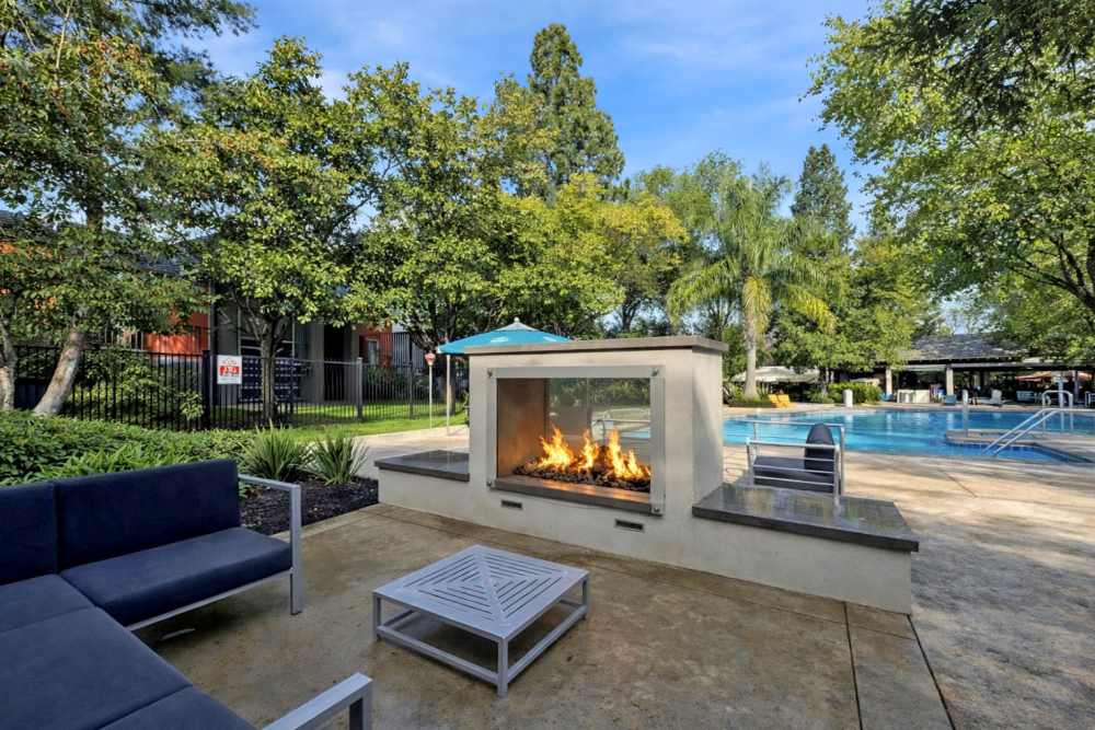 Outdoor lounge seating with firepit at Falls at Arden in Sacramento, California