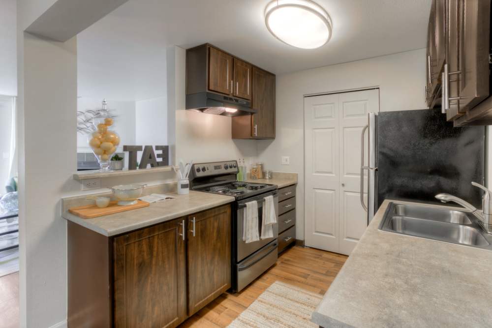 Kitchen with granite countertop  at Newport Crossing Apartments in Newcastle, Washington