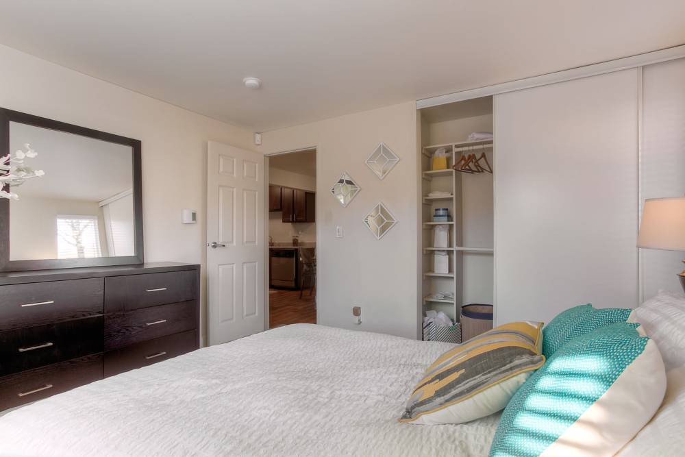 Bedroom with dresser  at Newport Crossing Apartments in Newcastle, Washington