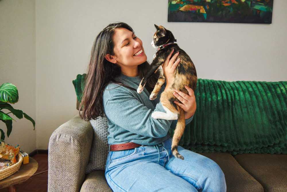 Woman with a cat at Seven17 Lehman in Houston, Texas