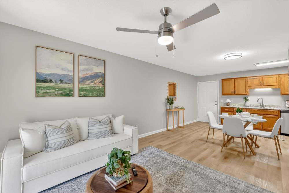 Open-concept floor plan with stylish living area, dedicated dining space, and generous kitchen countertops.