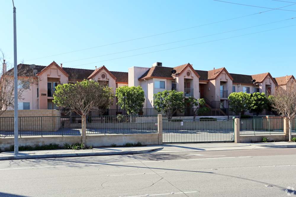 Apartment Exterior with Trees at Sunrise Fountains in Anaheim, California.