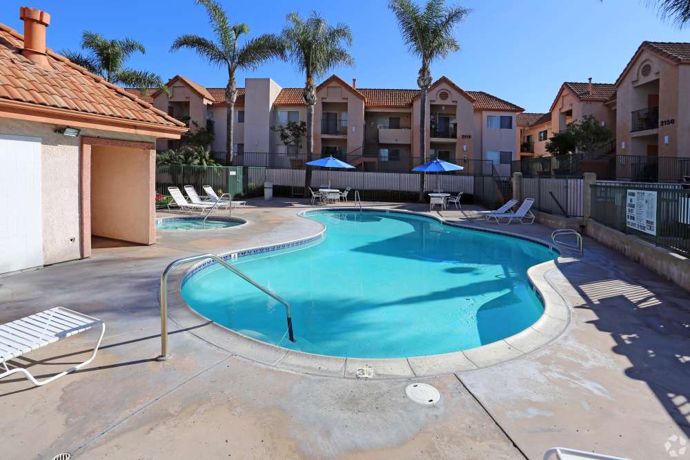 Apartment pool area with relaxing spa tub at Sunrise Fountains in Anaheim, California.