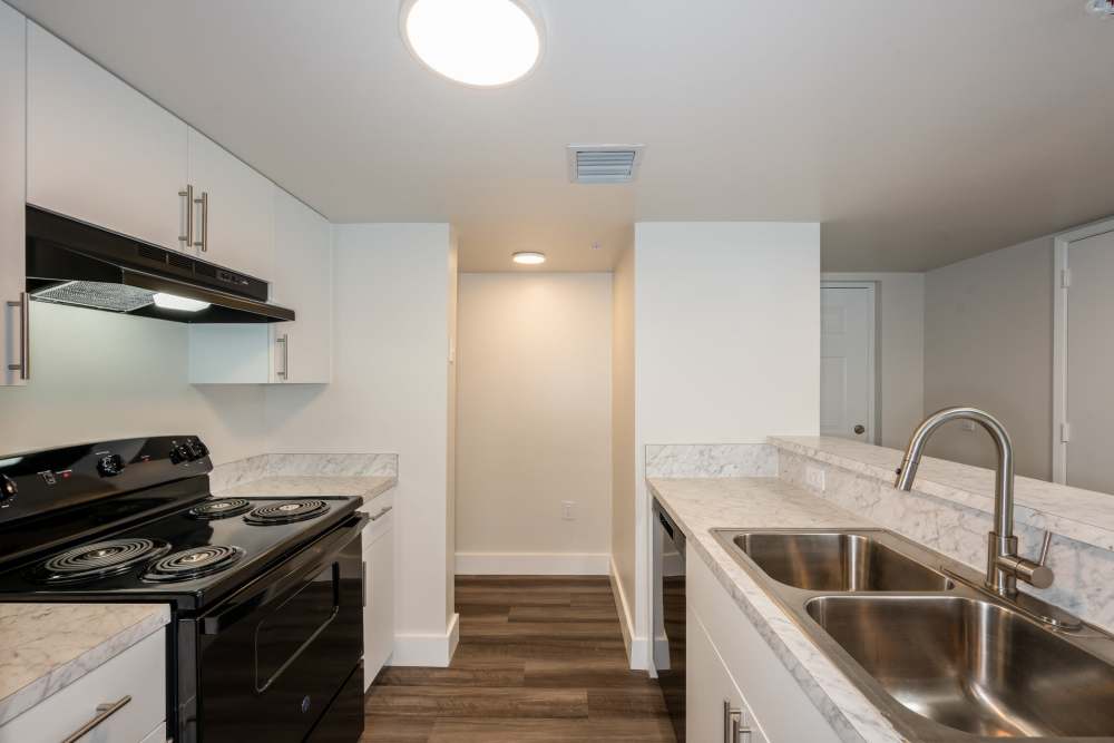 Model and fully equipped kitchen and laundry space at Ernie Martin Villas in Miami, Florida