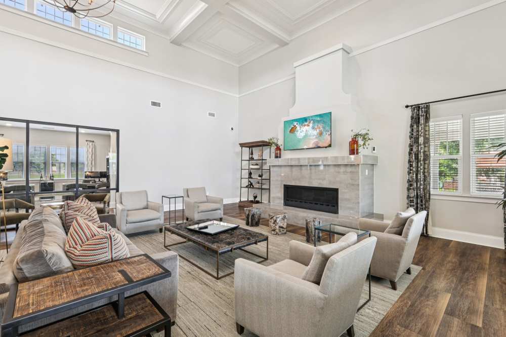 Spacious lounge with high ceiling, multiple seating areas, and large windows at The Drake in Bowling Green, Kentucky