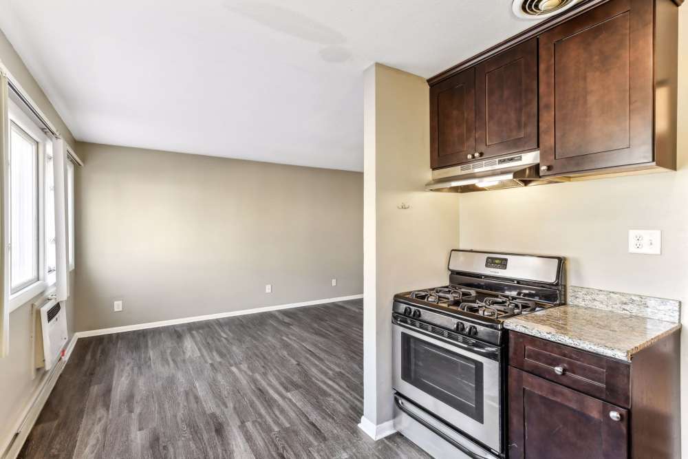 Kitchen with steel appliances and dining area at West End Trails in Golden Valley, Minnesota